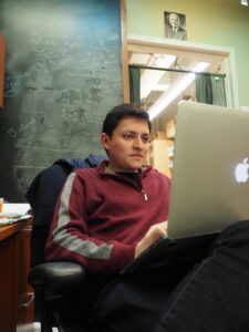 PhD student Aldo on computer